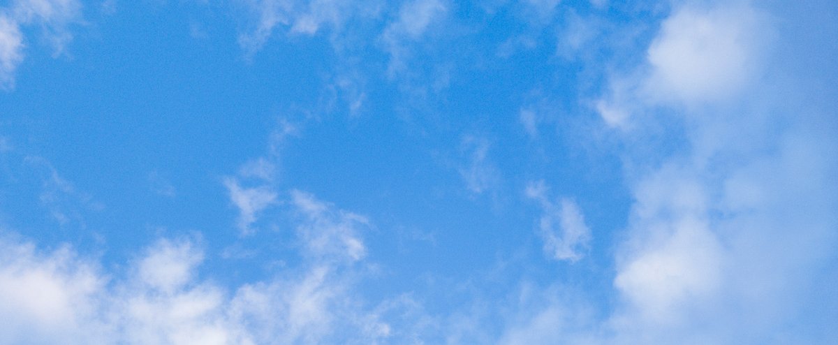 Blue sky with scattered clouds
